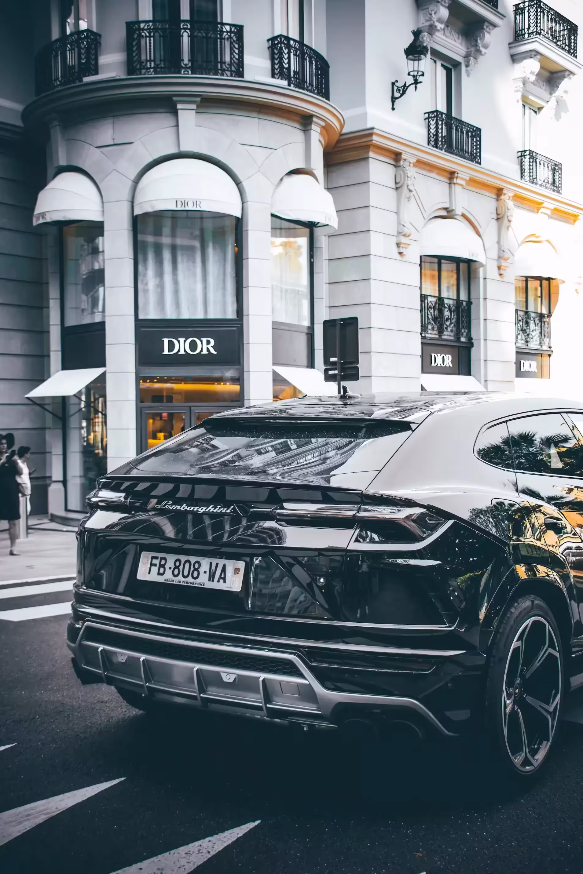 Lamborgini Urus driving down main street